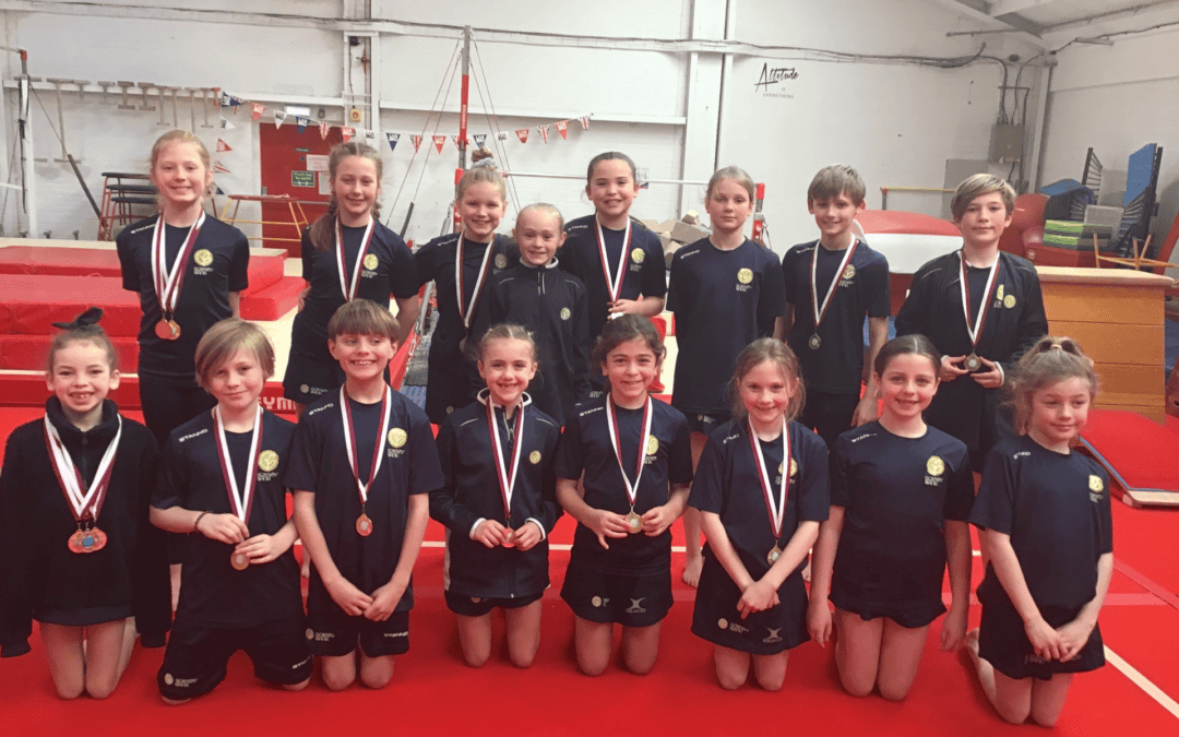Gorsey Bank Gymnasts posing with their medals.